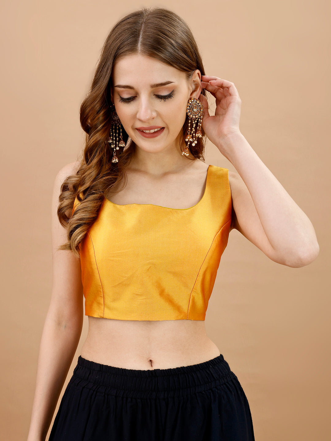 Yellow colored sleeveless tafeta blouse